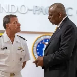 Lloyd J. Austin III speaks with Adm. John Aquilino, at U.S. Indo-Pacific Command headquarters, Camp H.M. Smith, Hawaii. Photo by Sgt. Sanders. US Department of Defense.