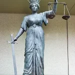 Scales of Justice at the Law Courts. Photo by John. Flickr.
